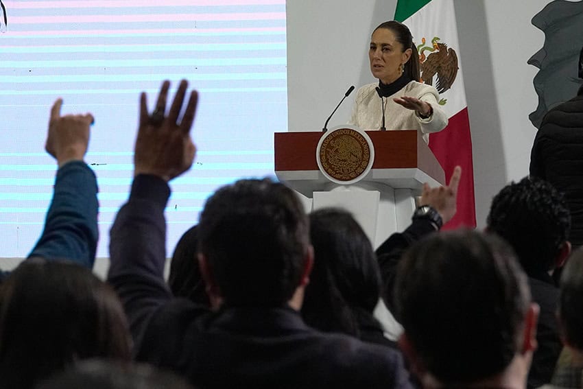 Sheinbaum speaks to a crowd of reporters at a press conference
