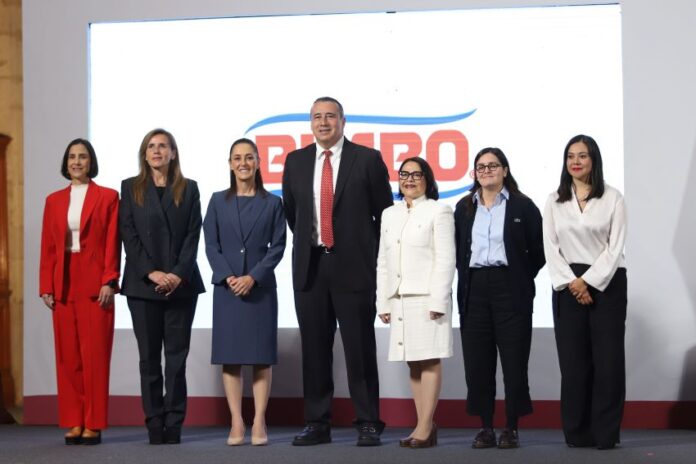 7 men and women standing on a stage
