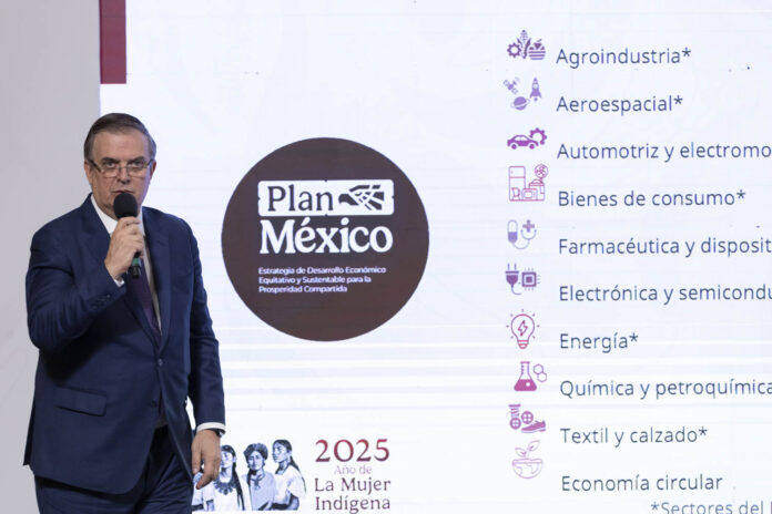 Economy Minister Marcelo Ebrard shares a slide reading Plan Mexico at a press conference