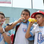More than one-third of Mexico’s schoolchildren are overweight or obese Three schoolboys drinking sugared drinks