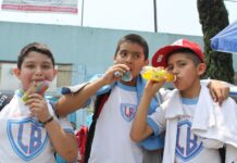 More than one-third of Mexico’s schoolchildren are overweight or obese Three schoolboys drinking sugared drinks