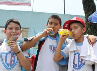 More than one-third of Mexico’s schoolchildren are overweight or obese Three schoolboys drinking sugared drinks