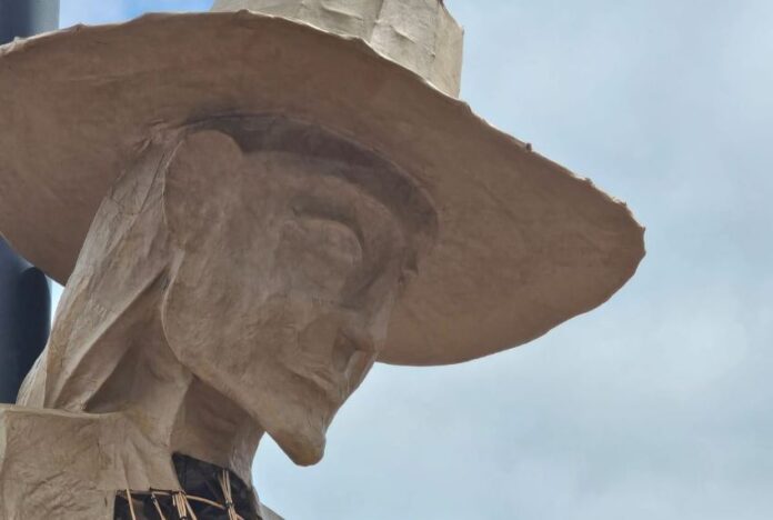 head of a statue of a searching mother in england
