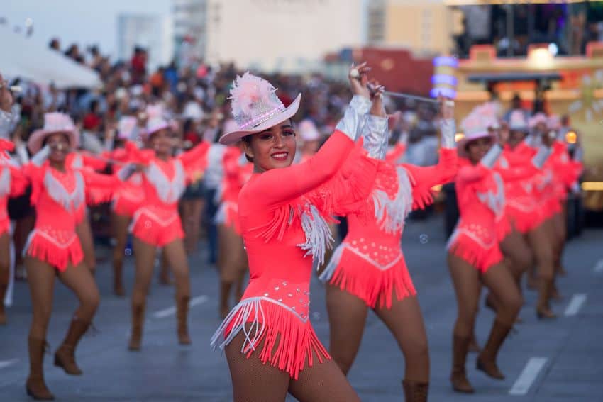Dancers in pink fringe costumes at the Veracruz Carnival