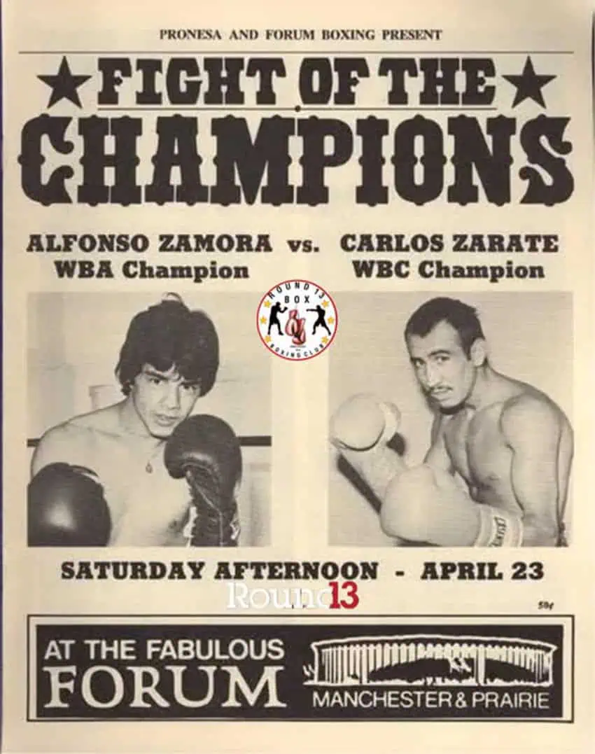 A vintage boxing promotional poster for "FIGHT OF THE CHAMPIONS" featuring a match between "ALFONSO ZAMORA WBA Champion" and "CARLOS ZARATE WBC Champion." Below their names are black and white images of the two boxers in fighting stance, wearing boxing gloves. The poster advertises the event for "SATURDAY AFTERNOON - APRIL 23" at "THE FABULOUS FORUM" located at "MANCHESTER & PRAIRIE," presented by "PRONESA AND FORUM BOXING."