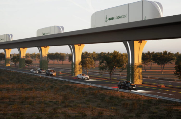 A rendering shows cargo containers moving along an automated freight corridor guideway above a highway