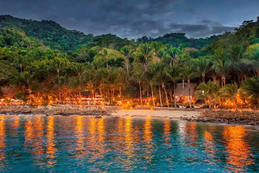 A well lit beach resort at sunset on the Puerto Vallarta coast