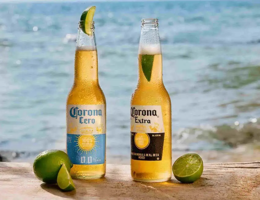 Two bottles of corona with lime slices
