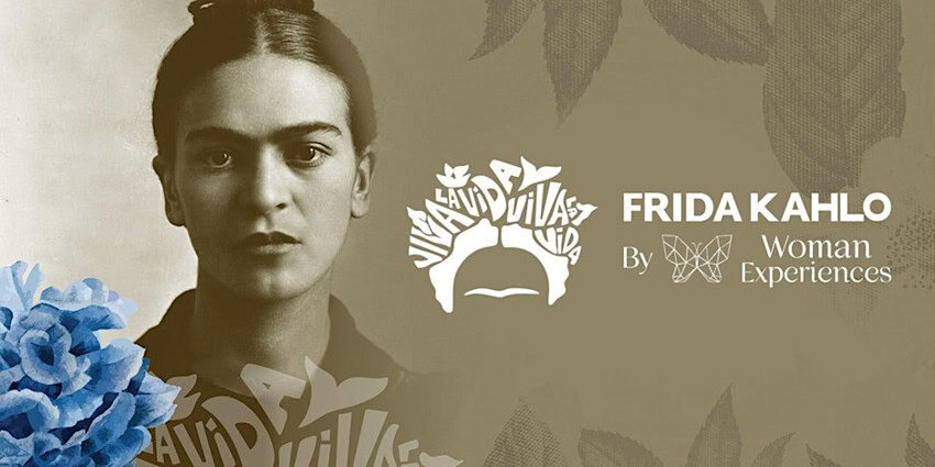 A sepia-toned image of Frida Kahlo with her hair pulled back is overlaid with a white design graphic of her head made up of the words "VIVA LA VIDA." To the right it says in white letters: "FRIDA KAHLO By Woman Experiences." Similar lettering also saying Viva la Vida appears under the collarbone of the Kahlo image.