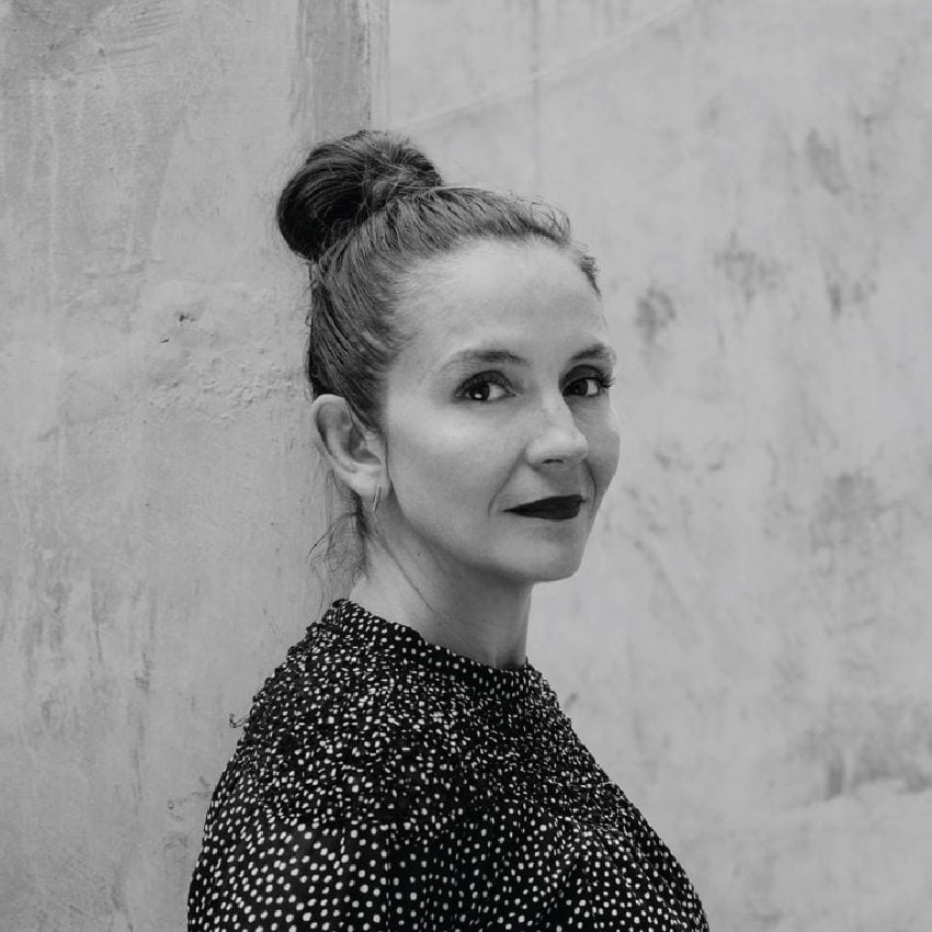 Mexican architect Gabriela Carillo posing for a black and white publicity photo in half-profile.