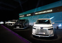 Claudia’s Chinese car conundrum: A perspective from our CEO GAC Chinese cars sit on a stage in a Mexican showroom in front of a banner reading "GAC Hybrid: Mas confiabilidad"