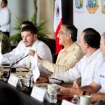 Governors of northeastern states agree to team up against border region insecurity several men seated at a dais