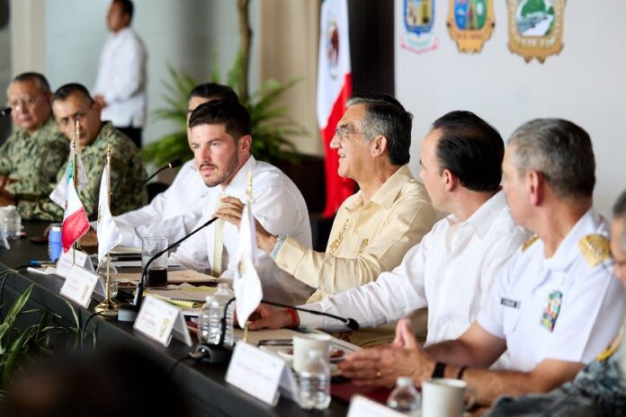 several men seated at a dais