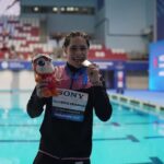 Mexican diver Osmar Olvera ends China’s run with a 3m springboard gold at the World Aquatics Championships swimmer showing medal by a pool