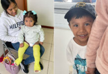 Two children, patients of Kids First Orthopaedics, smile at the camera. One little girl has casts on both legs. The other, a little boy, hides behind his mother