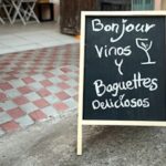 A billboard outside an open restaurant