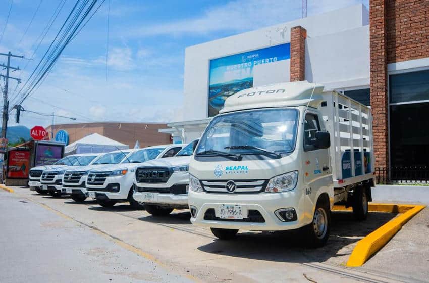 A row of new white service vehicles bearing the logo for and name of SEAPAL. The truck closest to the foreground has the brand name FOTON over its top.