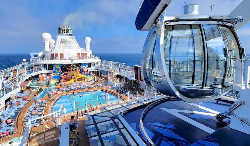 An overview of the Carnival of the Seas cruise ship showing the viewing deck and pool.