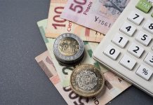 Mexican peso loses ground following a weak US jobs report Mexican peso bills, coins and a calculator