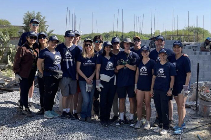 A group of teenagers pose for a photo