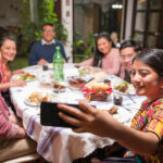 A Mexican family eats food together and enjoys a meal