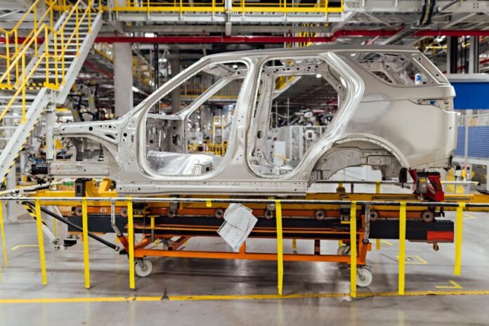 shell of a car on the assembly line