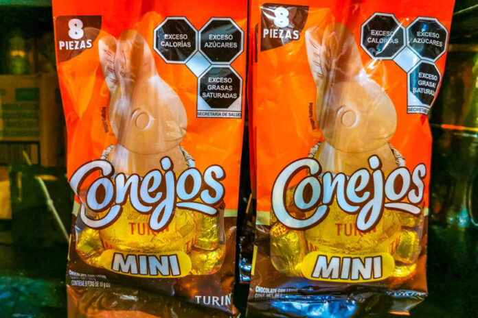 Two orange packages of the Mexican candy Conejos, a brand of rabbit-shaped chocolates, for sale in Puerto Escondido, Oaxaca.