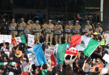 My thoughts on the US protests: A perspective from our CEO Protesters with Mexican flags and signs stand in front of a wall of California National Guard troops