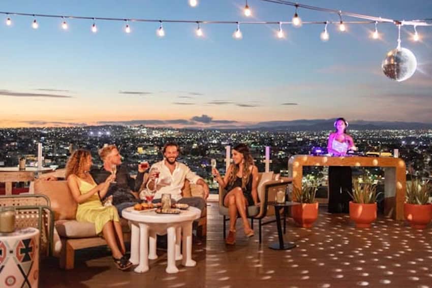 People enjoying a rooftop bar