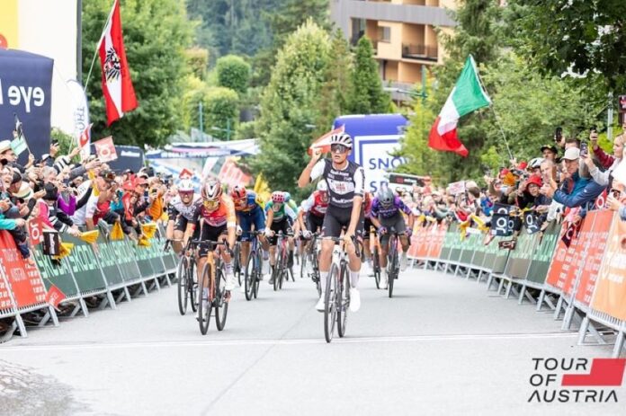 Cyclist Isaac del Toro crosses the finish line at a race in Austria
