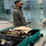 Foreign national caught with over a million pesos of ketamine in Cancún airport A man stands by an open suitcase in an airport revision area